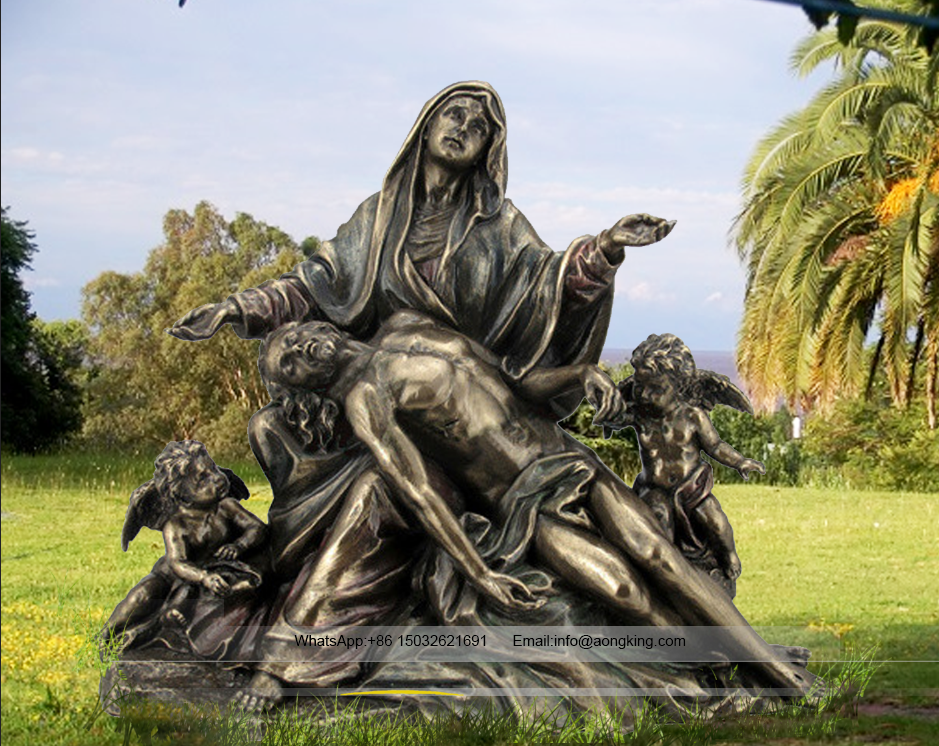 bronze statue of Mary holding Jesus with angel