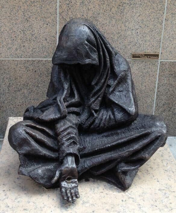 bronze statue Jesus as a homeless beggar draws