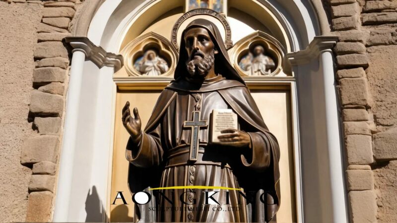 Saint Benedict statue with Rule of Saint Benedict